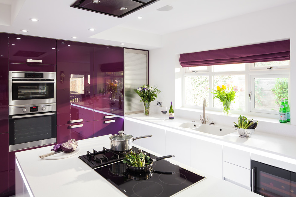 Design ideas for a large contemporary kitchen in Kent with flat-panel cabinets and with island.