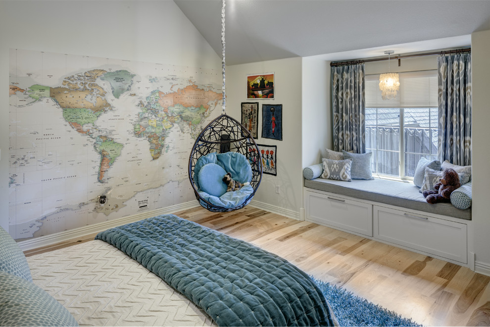 Photo of a large transitional gender-neutral kids' room in Other with medium hardwood floors.