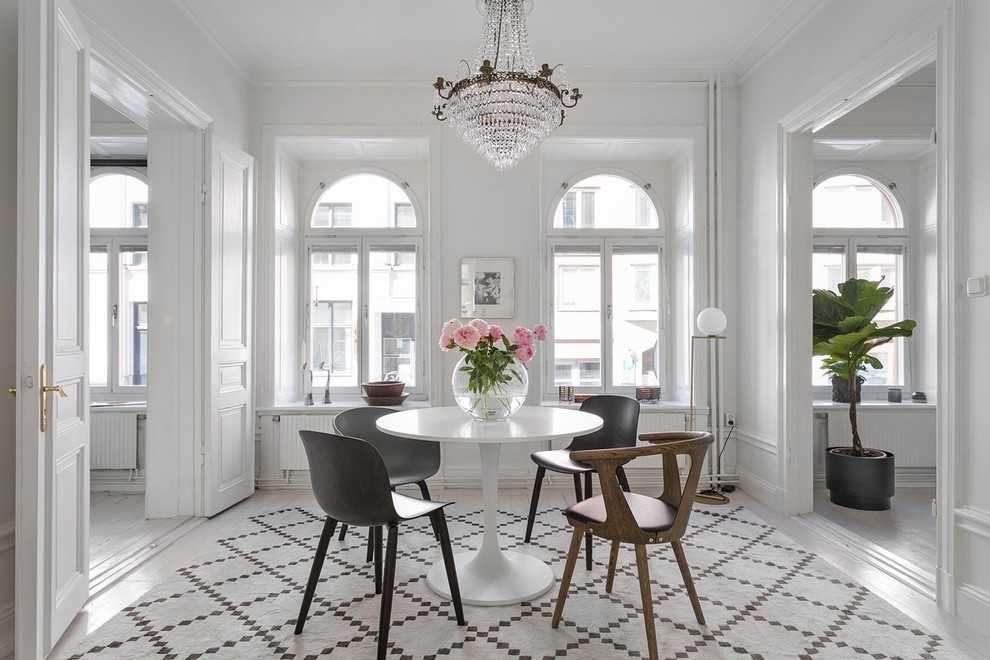 Inspiration for a mid-sized traditional kitchen/dining combo in Stockholm with white walls and no fireplace.