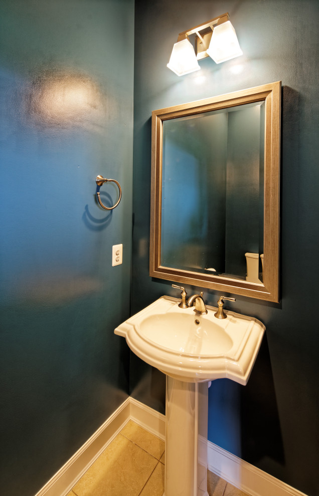 This is an example of a small traditional powder room in DC Metro with blue walls, a pedestal sink, beige floor, white benchtops, ceramic floors and a freestanding vanity.