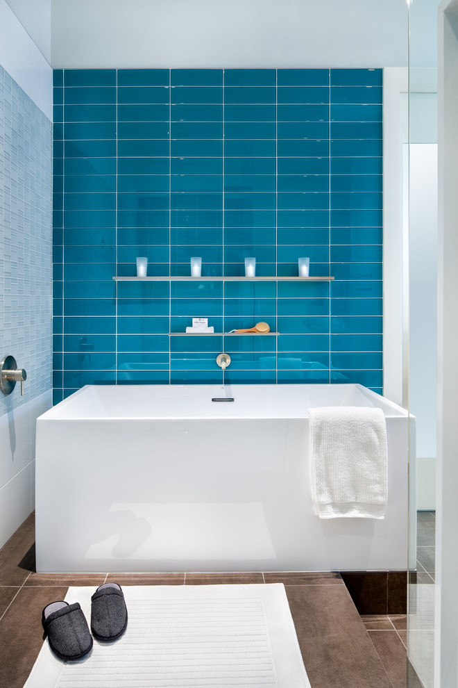 Inspiration for a mid-sized contemporary master bathroom in Austin with a freestanding tub, an open shower, blue tile, white walls, ceramic floors and glass tile.