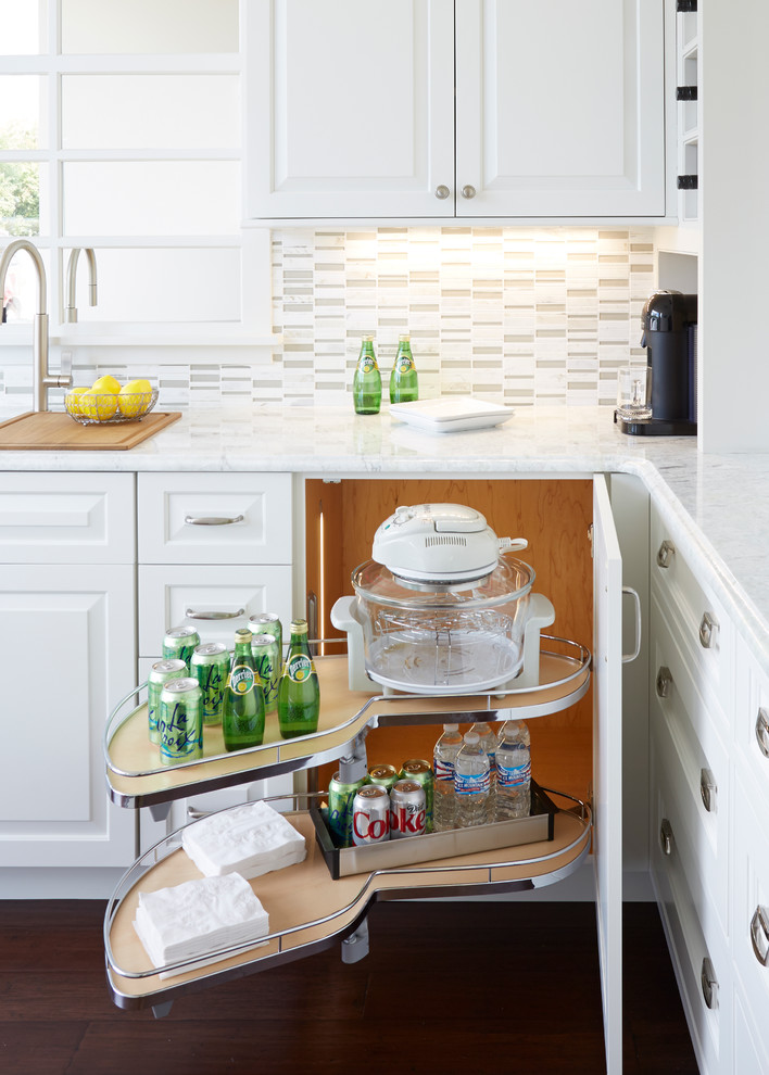 Inspiration for a mid-sized transitional u-shaped dark wood floor open concept kitchen remodel in Chicago with an undermount sink, raised-panel cabinets, white cabinets, quartz countertops, multicolored backsplash, matchstick tile backsplash, stainless steel appliances and an island