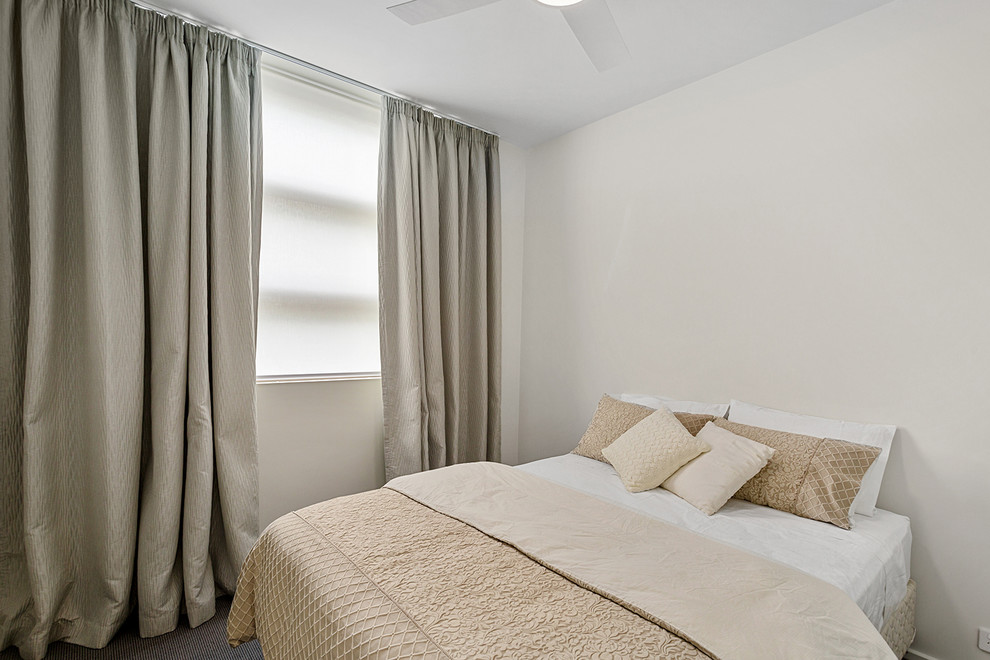 Design ideas for a mid-sized contemporary master bedroom in Melbourne with white walls, carpet and beige floor.