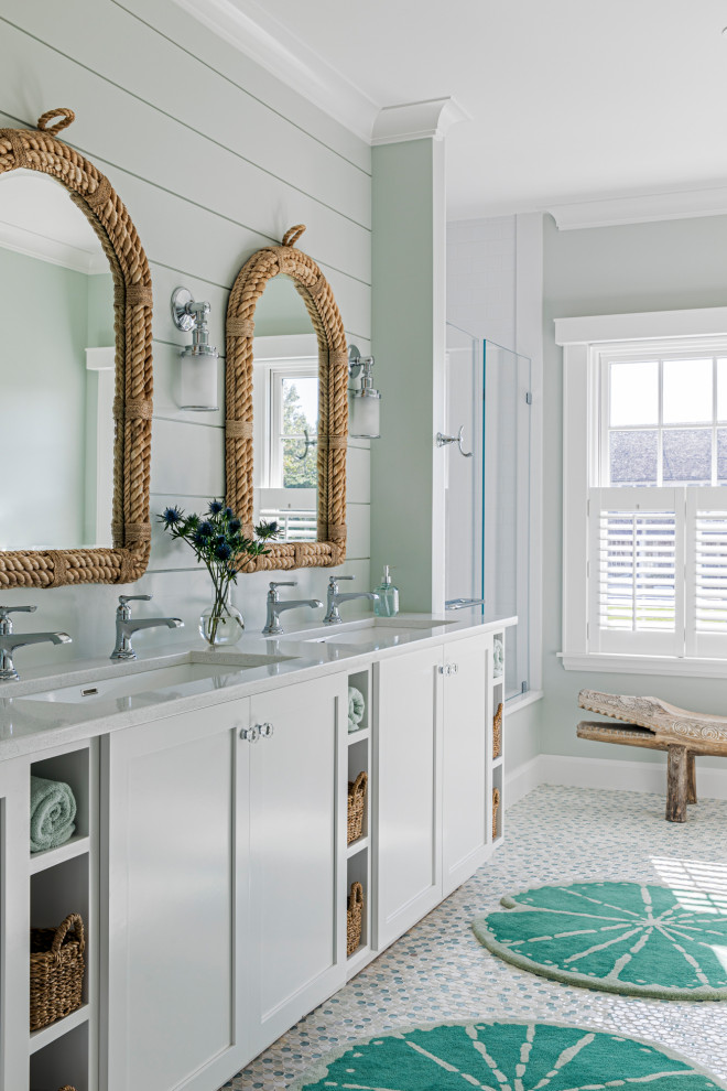 Inspiration for a mid-sized beach style kids bathroom in Boston with white cabinets, quartzite benchtops, white benchtops, a single vanity, a built-in vanity, shaker cabinets, an alcove shower, grey walls, mosaic tile floors, an undermount sink, multi-coloured floor, a hinged shower door and planked wall panelling.