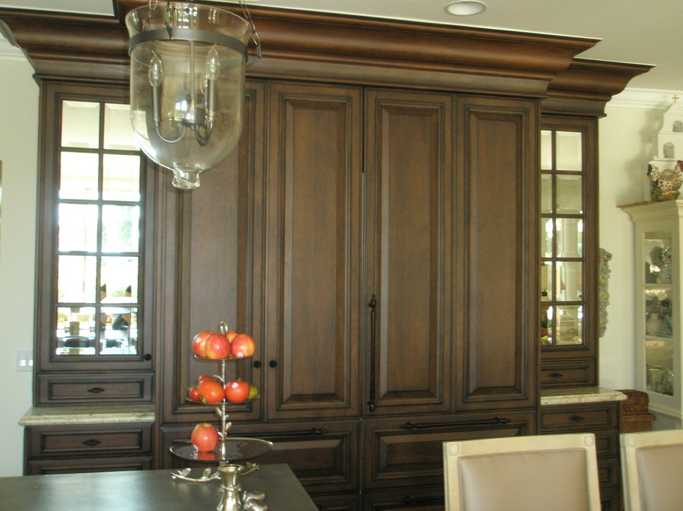 Photo of a traditional dining room in Orange County with travertine floors.
