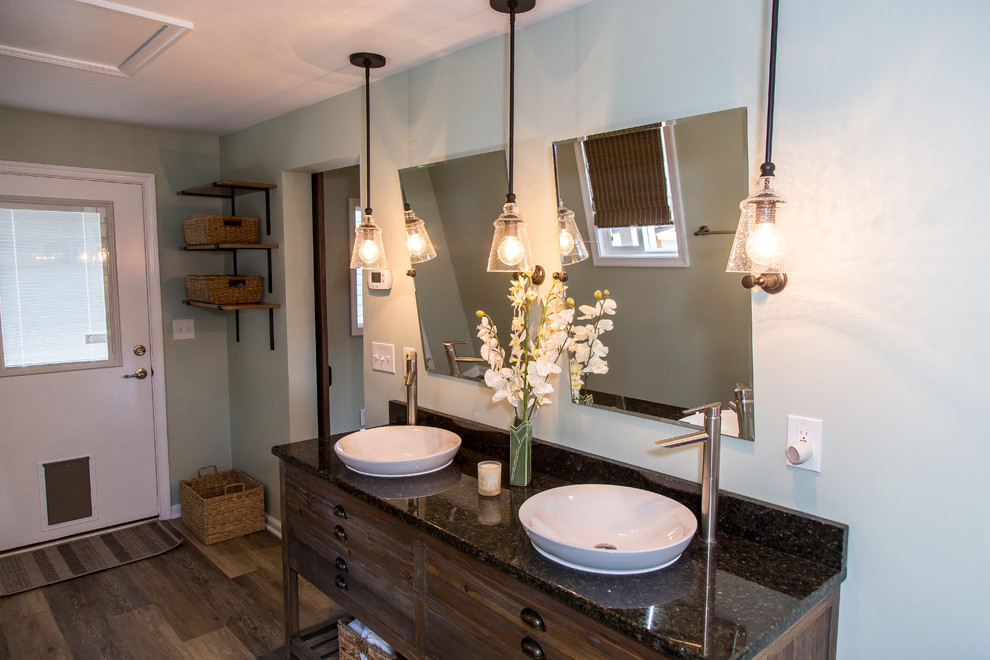 Photo of a mid-sized transitional 3/4 bathroom in Other with furniture-like cabinets, distressed cabinets, a shower/bathtub combo, white tile, ceramic tile, grey walls, vinyl floors, a vessel sink, granite benchtops, brown floor and an open shower.
