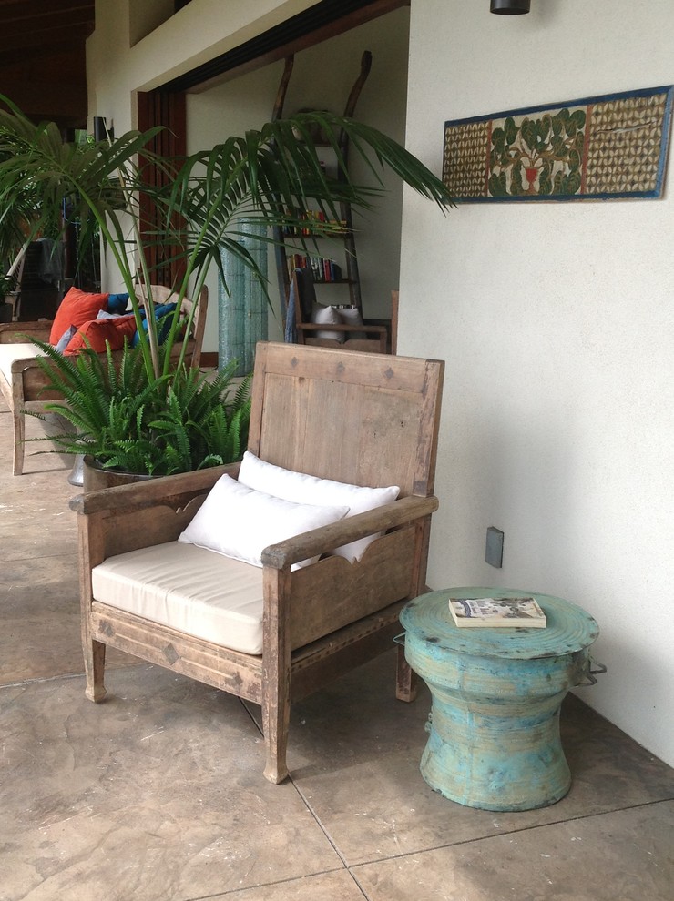 Inspiration for a large tropical backyard patio in Hawaii with no cover and concrete pavers.