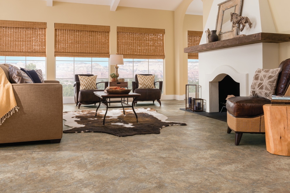 Example of a large mountain style formal and open concept vinyl floor living room design in Chicago with beige walls, a standard fireplace, a plaster fireplace and no tv