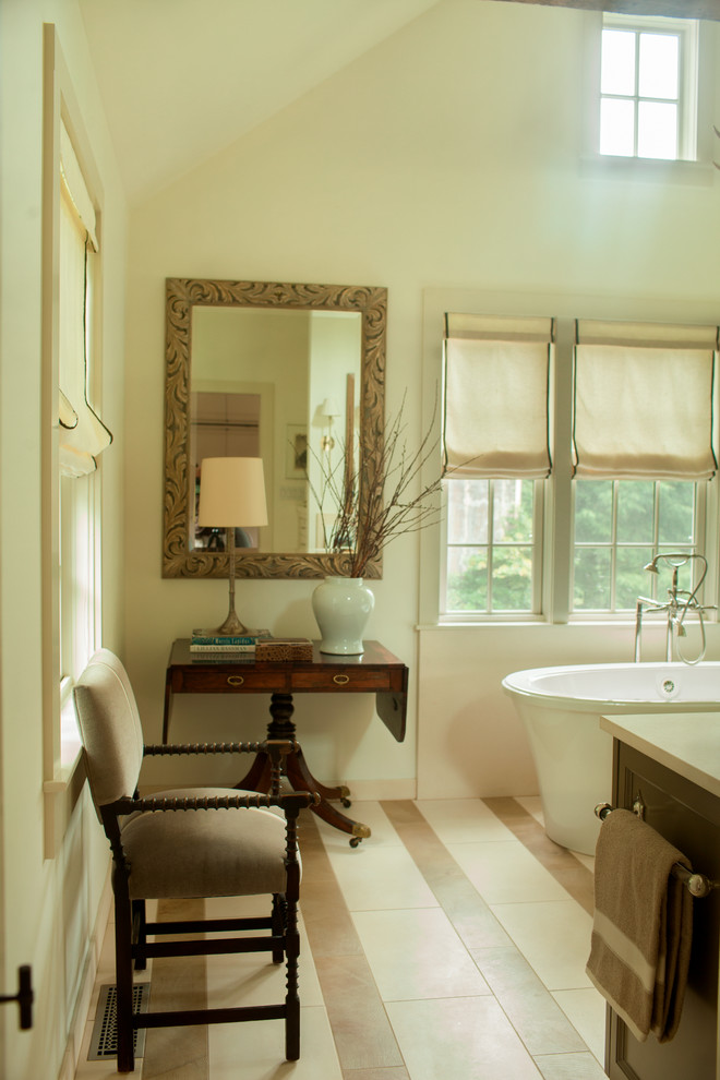 This is an example of a transitional bathroom in Dallas with a freestanding tub.