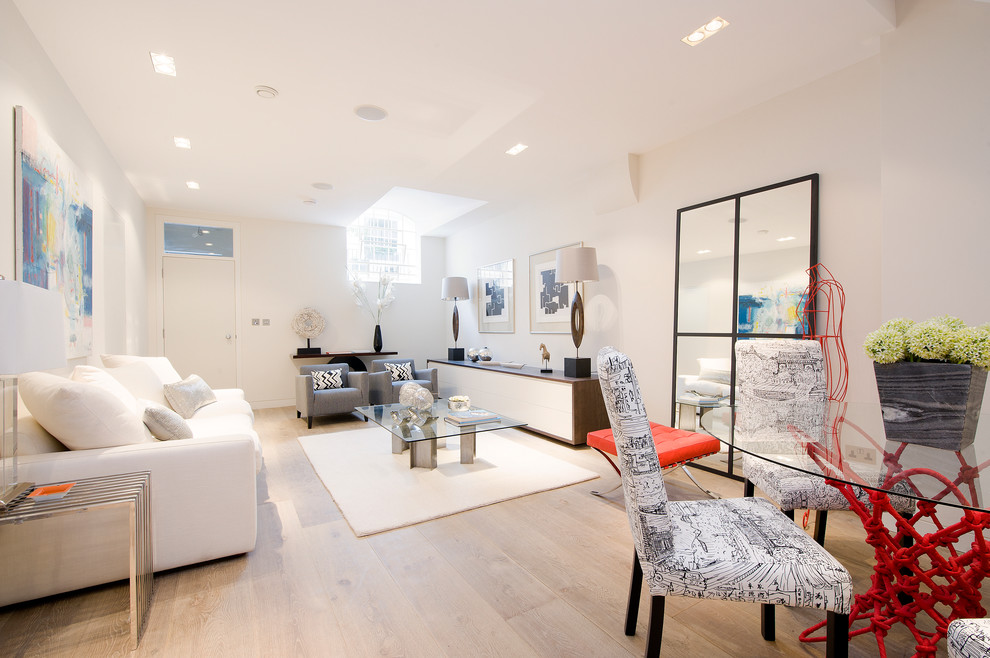 This is an example of a mid-sized eclectic formal open concept living room in London.
