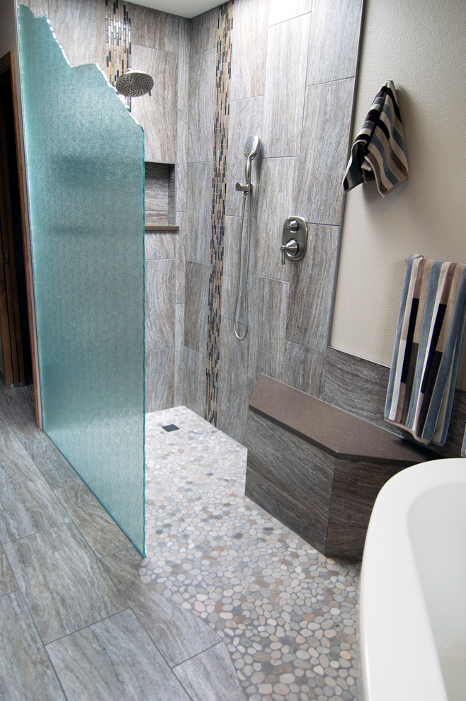 Freestanding bathtub - large rustic master brown tile and porcelain tile porcelain tile freestanding bathtub idea in Seattle with shaker cabinets, dark wood cabinets, a one-piece toilet, beige walls, an undermount sink and quartz countertops