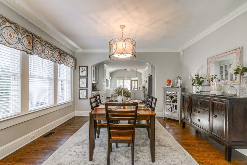 This is an example of a mid-sized traditional separate dining room in Atlanta with grey walls, medium hardwood floors, no fireplace and brown floor.