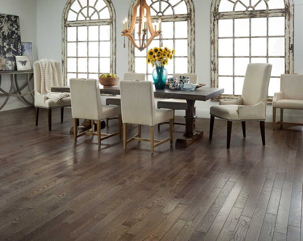 Photo of a rustic dining room in Other with dark hardwood flooring and grey floors.