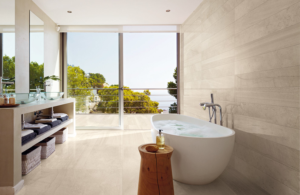 This is an example of a contemporary bathroom in Christchurch with a vessel sink, open cabinets and a freestanding tub.