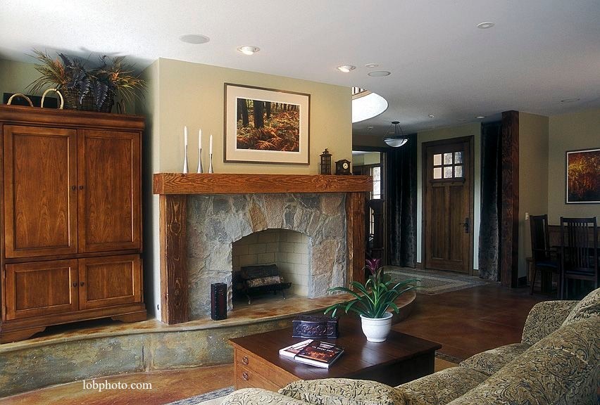 Large traditional open concept family room in Chicago with beige walls, concrete floors, a standard fireplace, a stone fireplace surround and a concealed tv.