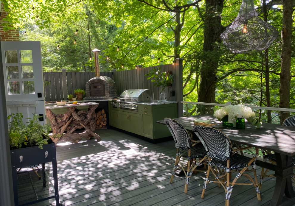 Bohemian back first floor glass railing terrace in DC Metro with an outdoor kitchen and no cover.