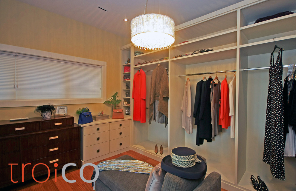 Large contemporary walk-in wardrobe in Vancouver with flat-panel cabinets and white cabinets.