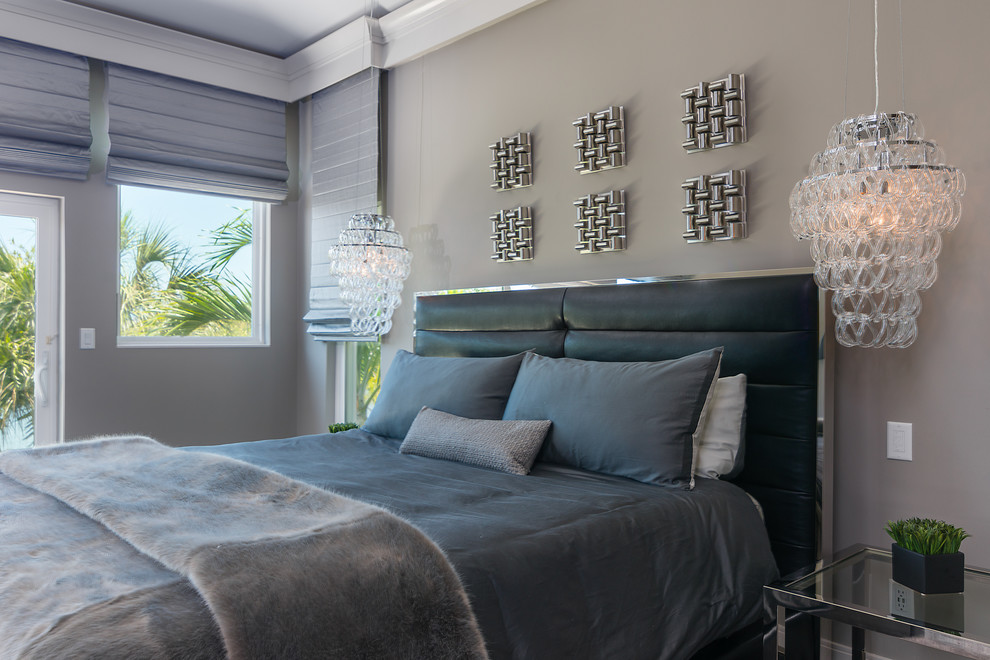 Photo of a large contemporary master bedroom in Tampa with grey walls, laminate floors and grey floor.