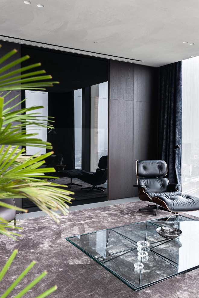 Источник вдохновения для домашнего уюта: большая объединенная гостиная комната в современном стиле с коричневыми стенами, скрытым телевизором, зоной отдыха, серым полом и деревянными стенами