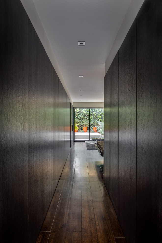 Photo of a mid-sized contemporary hallway in San Francisco with black walls.