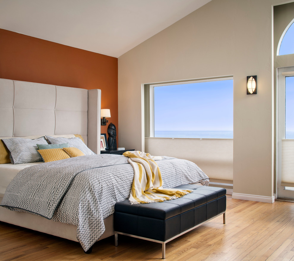 Example of a mid-sized minimalist master light wood floor bedroom design in San Francisco with multicolored walls and no fireplace