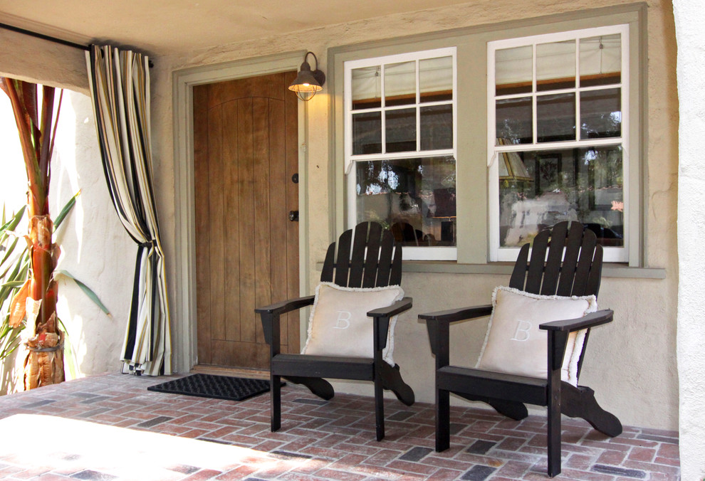 Design ideas for a mediterranean front yard verandah in Orange County.