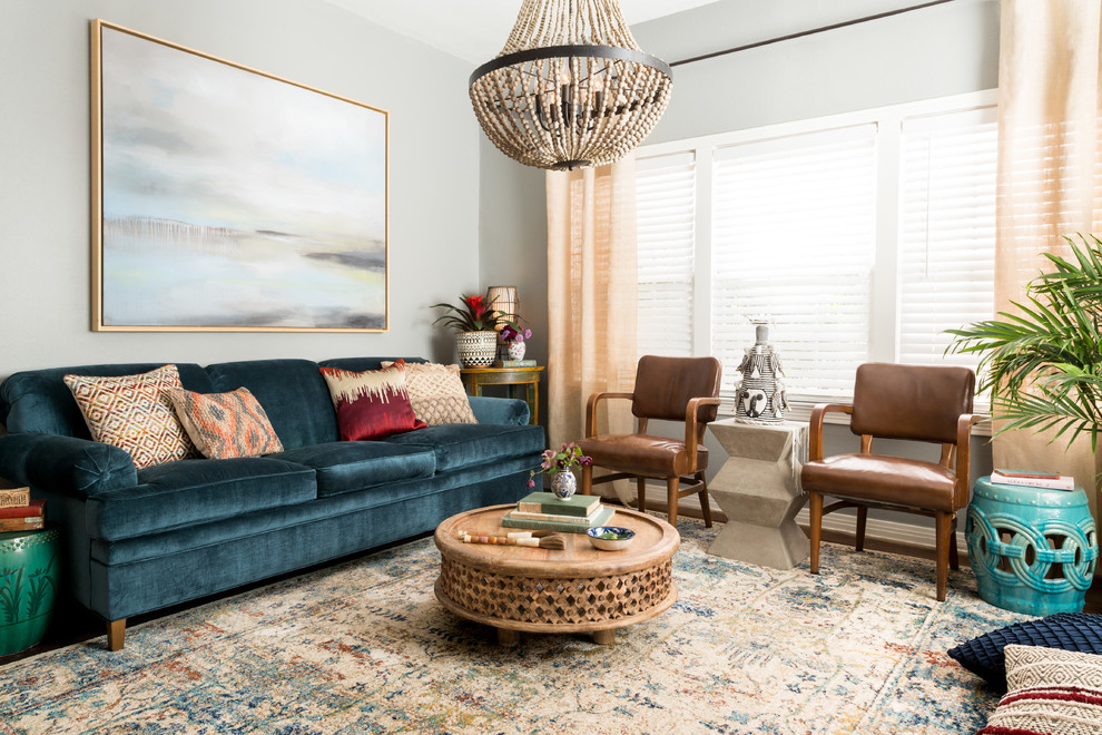Example of an eclectic formal living room design in Dallas with gray walls and no fireplace
