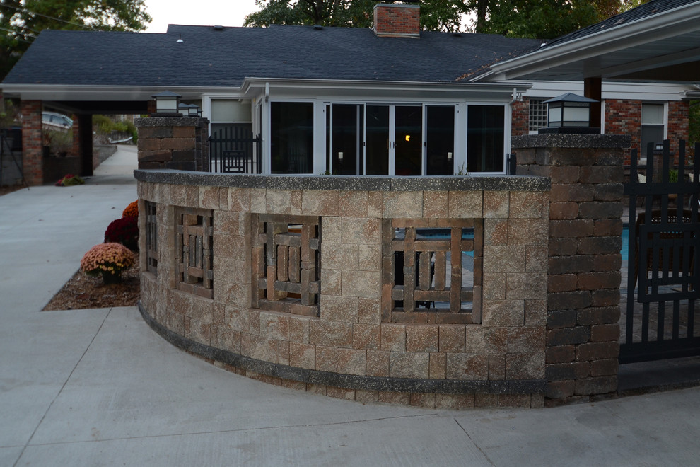 Mountain style backyard concrete paver home design photo