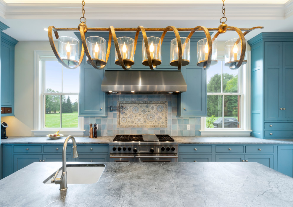 Large country l-shaped separate kitchen in Philadelphia with a farmhouse sink, beaded inset cabinets, blue cabinets, soapstone benchtops, blue splashback, ceramic splashback, panelled appliances, porcelain floors, with island, orange floor, black benchtop and recessed.