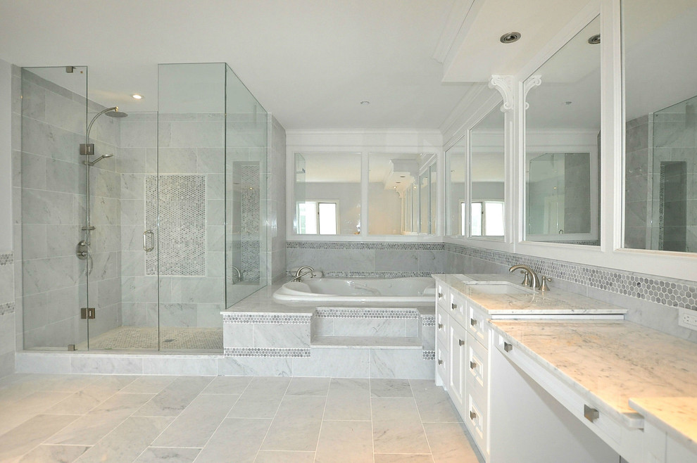Large transitional master bathroom in Toronto with shaker cabinets, white cabinets, a hot tub, a corner shower, white tile, stone tile, white walls, an undermount sink, marble benchtops, marble floors, blue floor, a hinged shower door and grey benchtops.