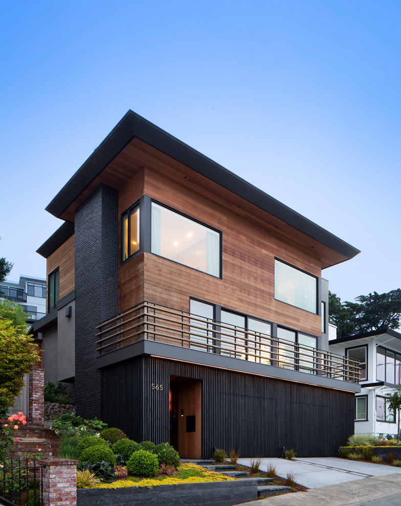 Inspiration pour une façade de maison marron design en bois à deux étages et plus.