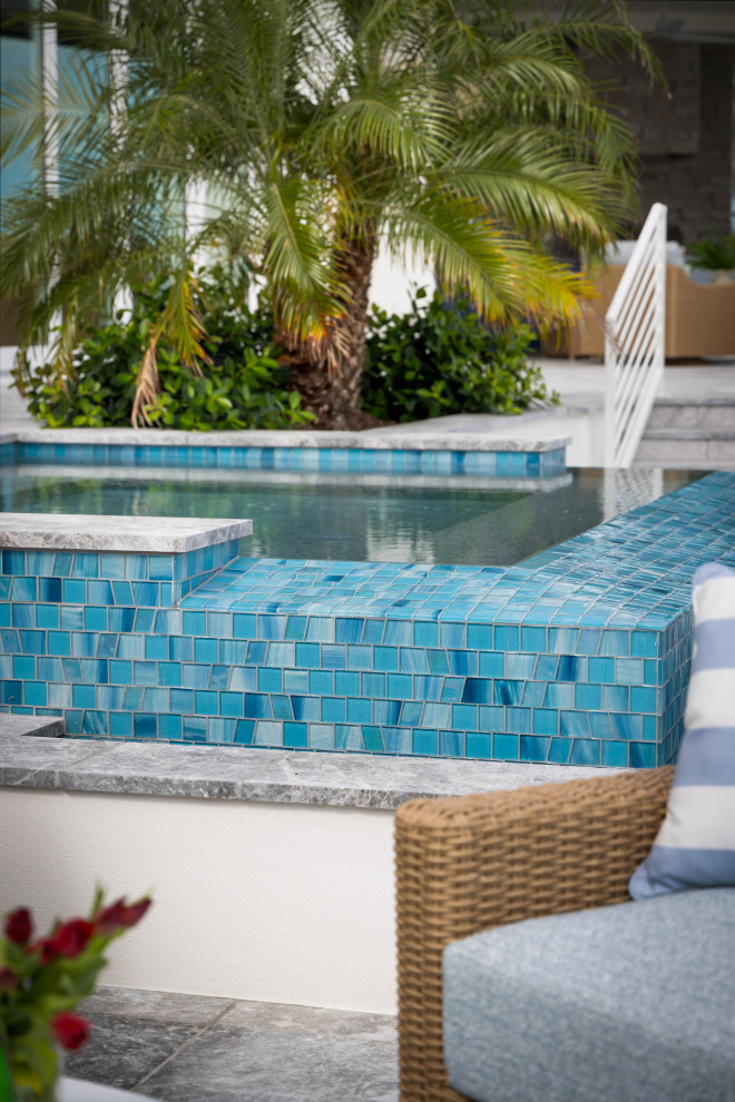 Beach style pool photo in Tampa