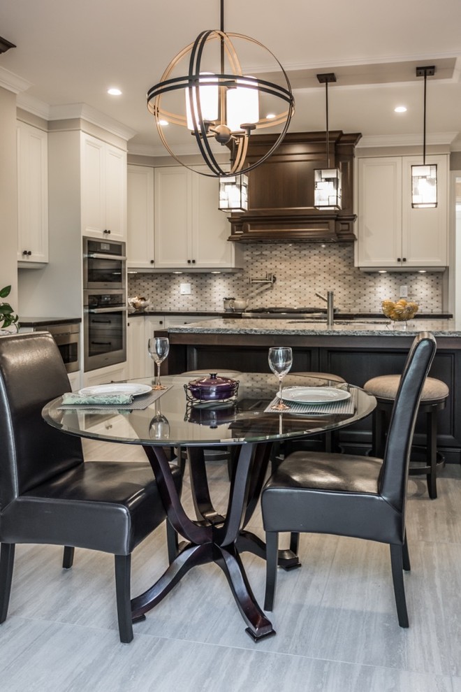 Mid-sized transitional l-shaped ceramic tile kitchen/dining room combo photo in Toronto with an undermount sink, shaker cabinets, dark wood cabinets, granite countertops, mosaic tile backsplash, stainless steel appliances, an island, gray backsplash, gray walls and no fireplace