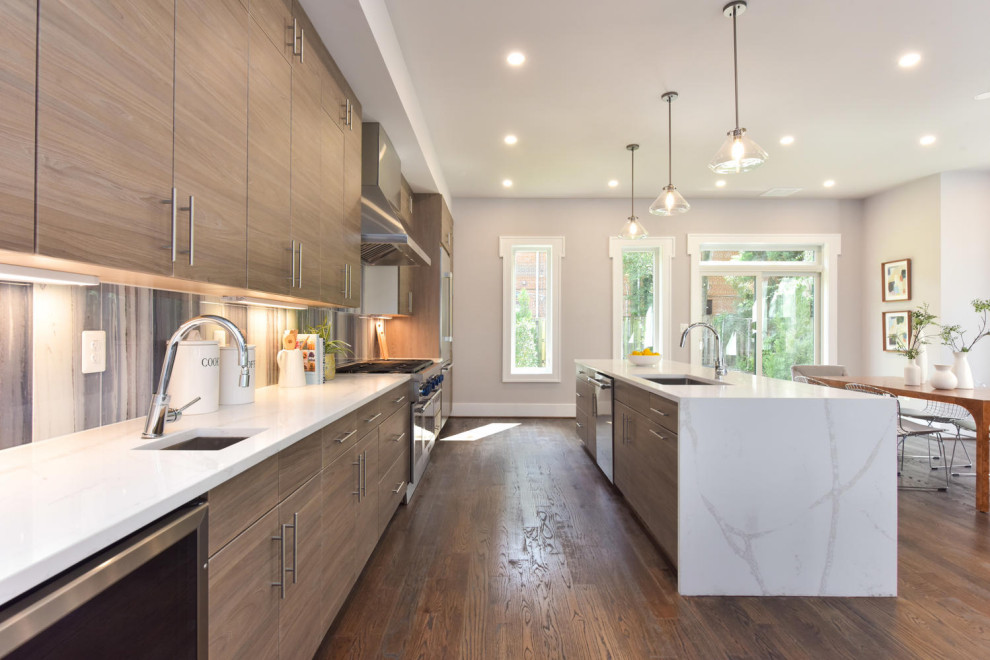 Example of a large trendy galley dark wood floor and brown floor eat-in kitchen design in DC Metro with a single-bowl sink, flat-panel cabinets, brown cabinets, quartzite countertops, multicolored backsplash, glass tile backsplash, stainless steel appliances, an island and white countertops