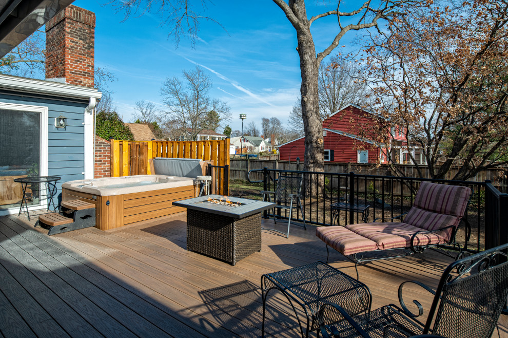 Inspiration for a large backyard ground level metal railing deck remodel in DC Metro