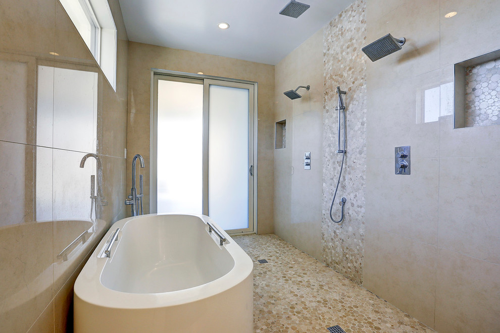 Design ideas for a contemporary master bathroom in DC Metro with a freestanding tub, a double shower, beige tile, pebble tile, beige walls and pebble tile floors.