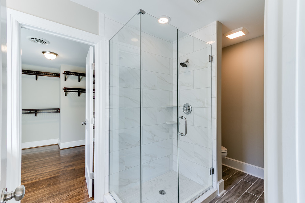 Inspiration for a master multicolored tile corner shower remodel in Richmond with gray walls, an integrated sink and marble countertops