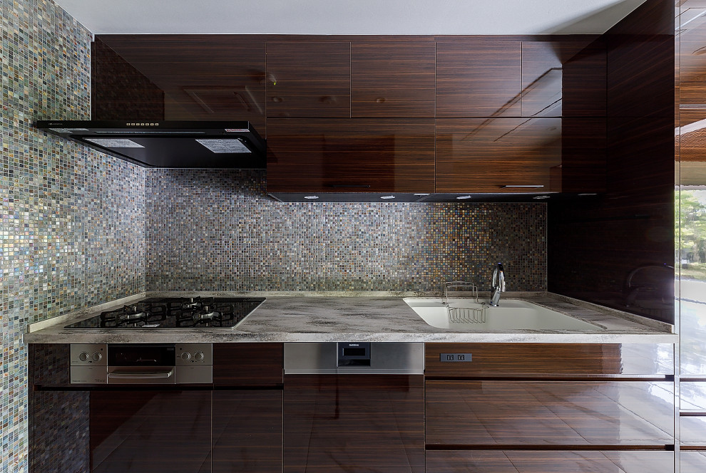 Example of a large single-wall ceramic tile, white floor and wallpaper ceiling enclosed kitchen design in Osaka with an integrated sink, flat-panel cabinets, dark wood cabinets, quartz countertops, brown backsplash, stainless steel appliances and gray countertops