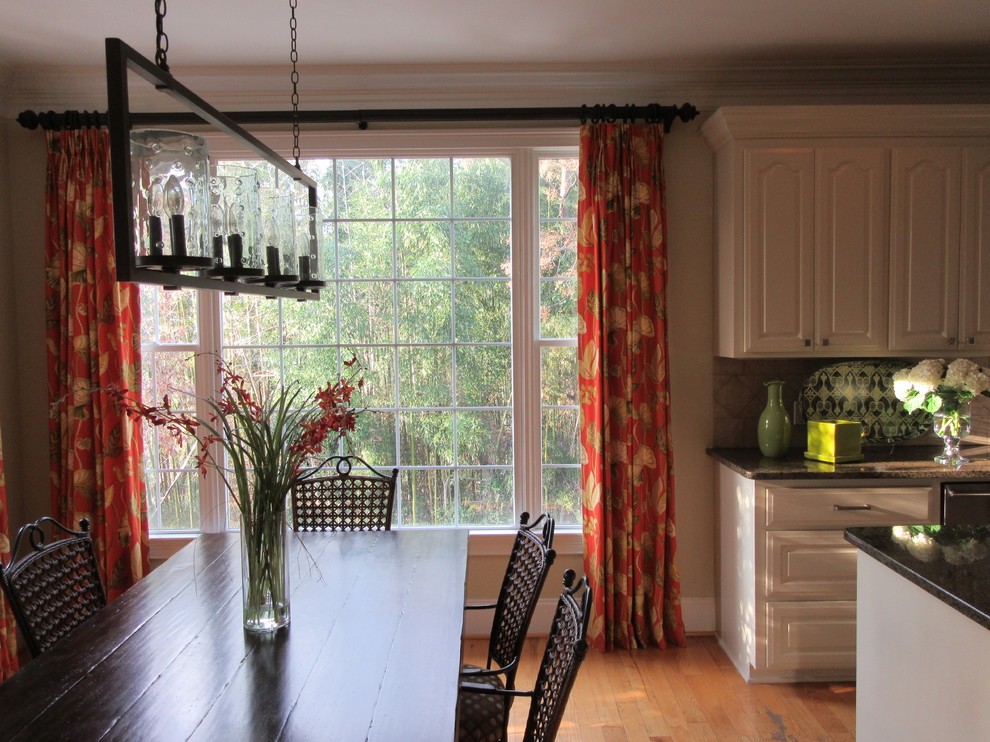 Example of a mid-sized transitional medium tone wood floor and beige floor great room design with beige walls and no fireplace