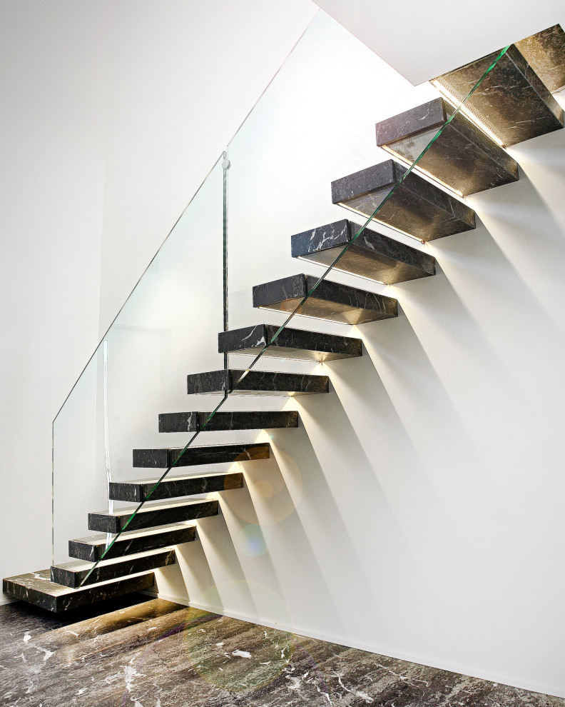 Design ideas for a mid-sized contemporary marble straight staircase in Other with glass railing.