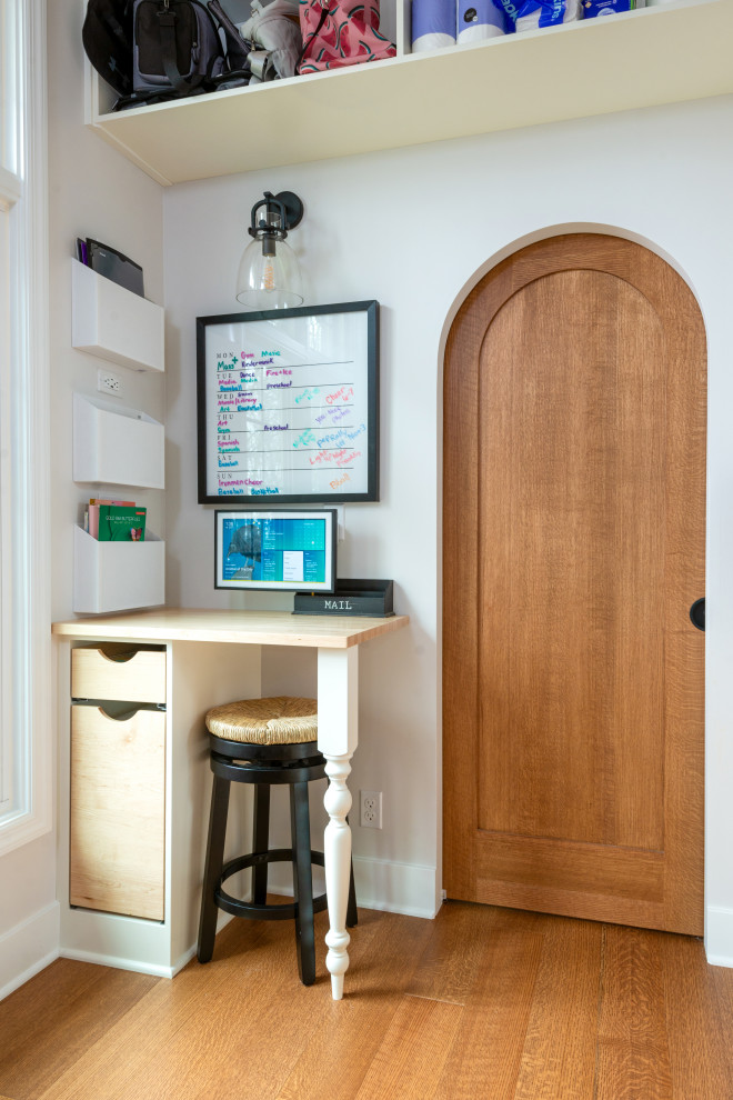 Inspiration for a large medium tone wood floor and exposed beam eat-in kitchen remodel with white backsplash, stainless steel appliances and an island