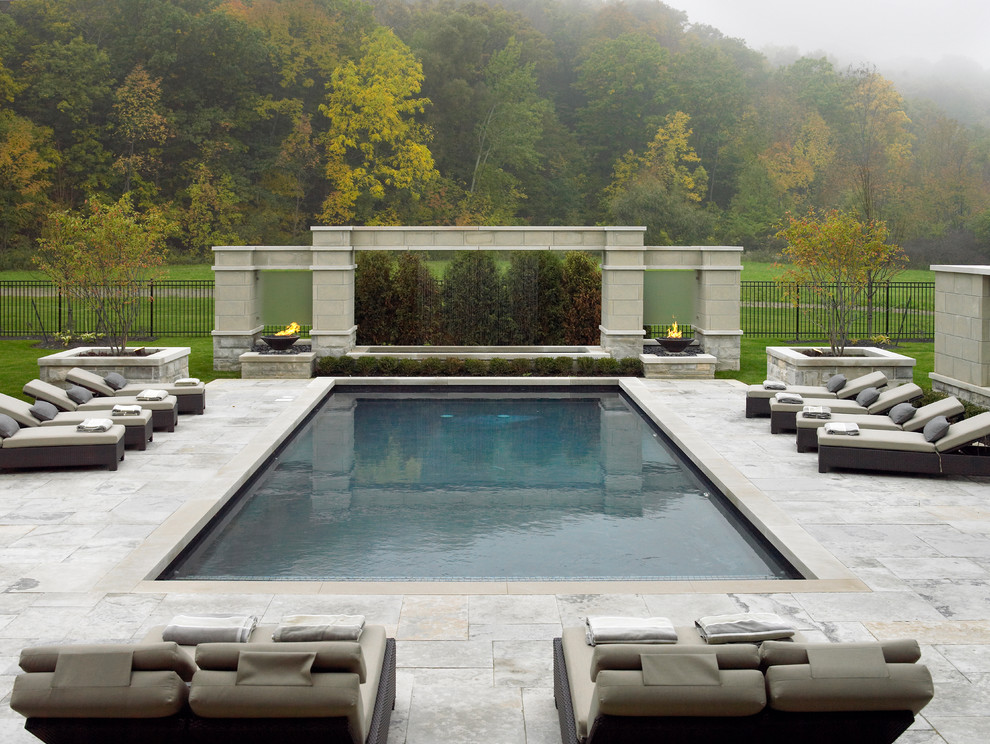 This is an example of a transitional backyard rectangular pool in Toronto.