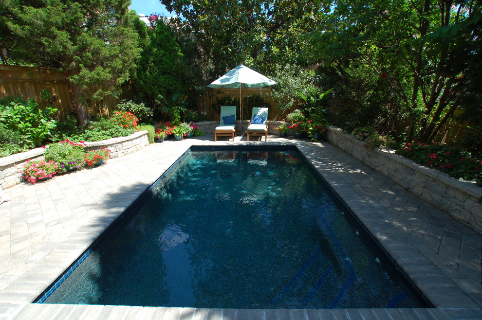 Inspiration for a small traditional backyard rectangular lap pool in DC Metro with concrete pavers.