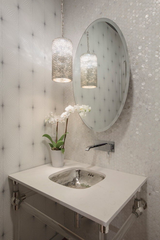 Photo of a transitional powder room in Los Angeles with an undermount sink and white walls.