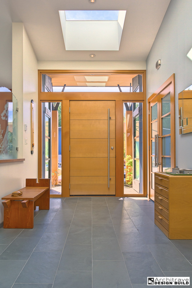 Mid-sized contemporary entryway in Vancouver with slate floors.