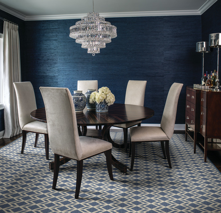This is an example of a mid-sized separate dining room in Denver with blue walls, carpet and no fireplace.