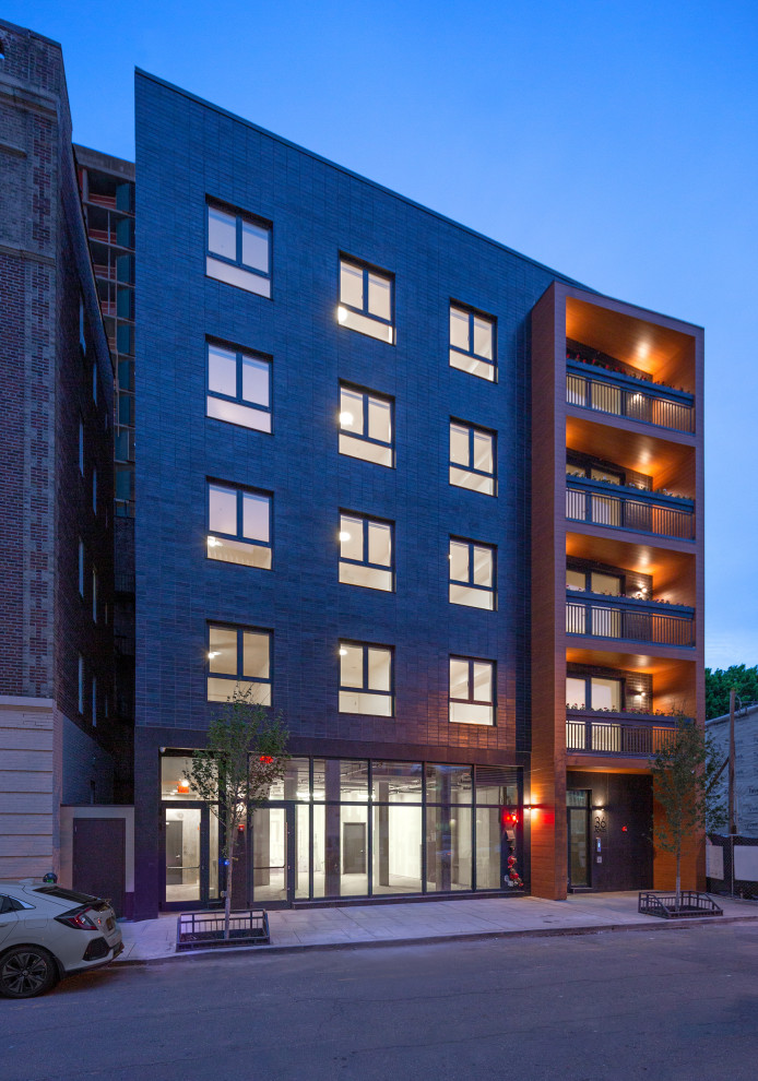 Design ideas for a contemporary brick apartment exterior in New York.