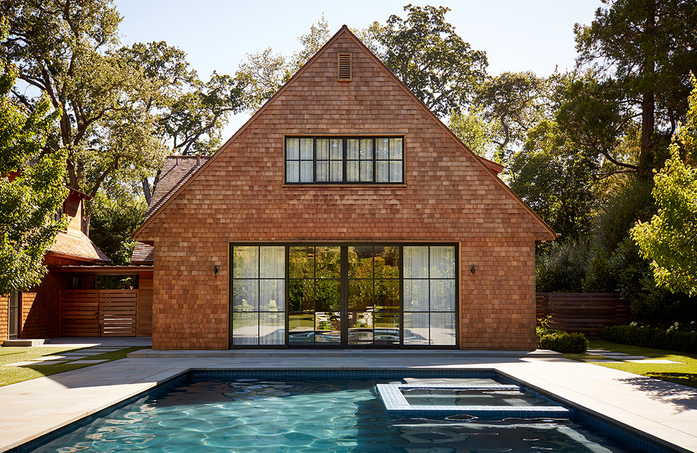 Inspiration for a large country brown two-story wood gable roof remodel in San Francisco with a shingle roof