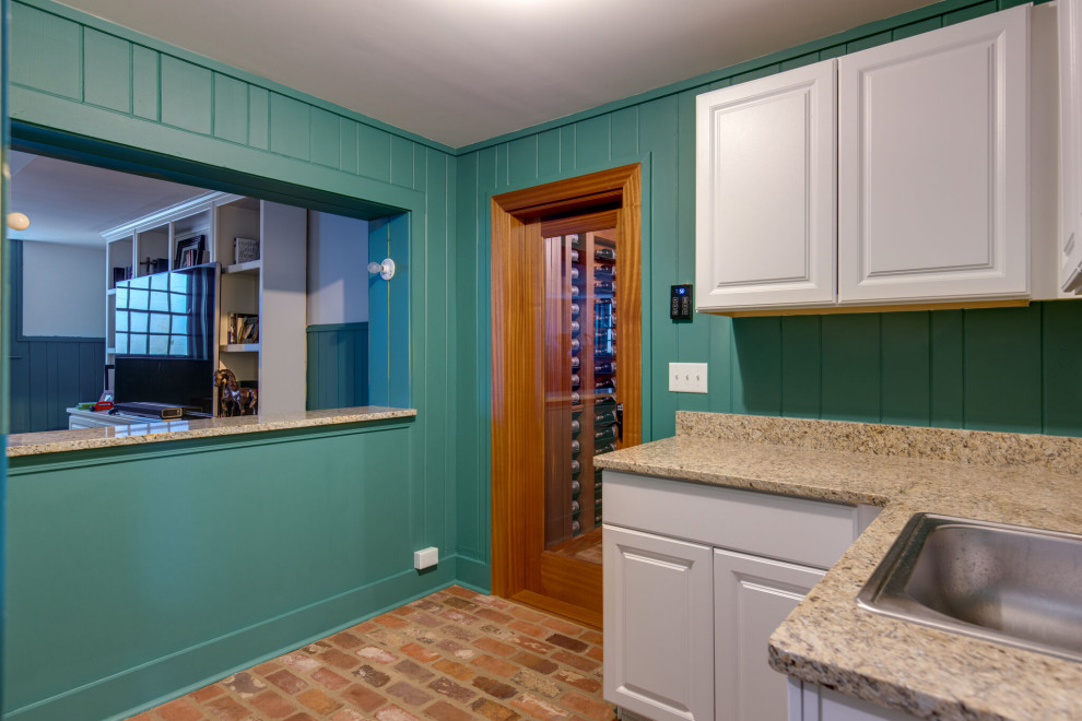 Secret passageway wine cellar. Basement layout with all mahogany racking.