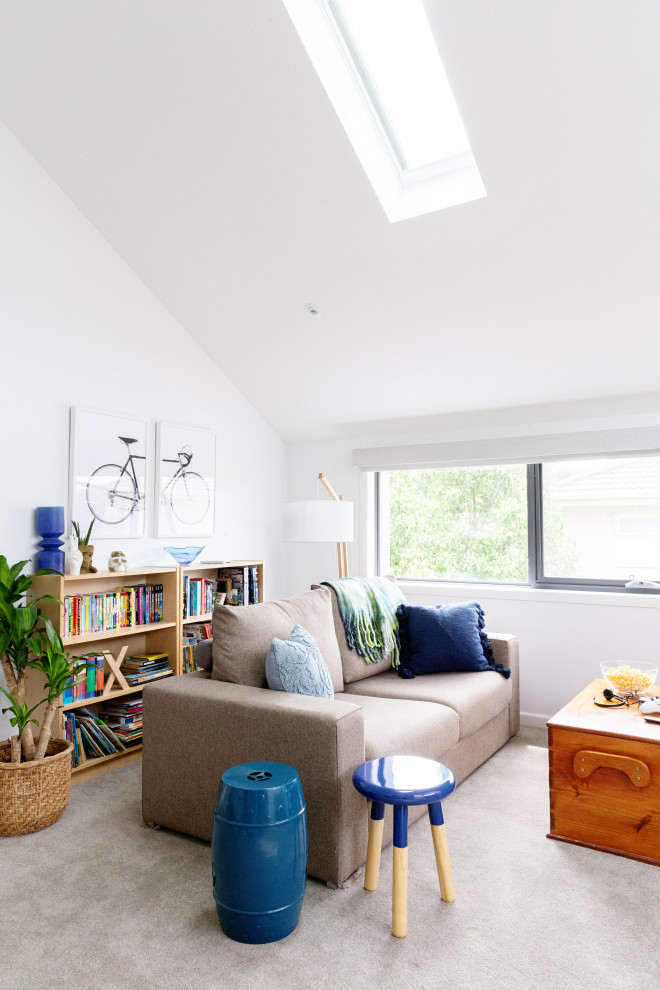Design ideas for a transitional family room in Melbourne with white walls, carpet, grey floor and vaulted.